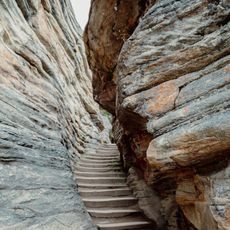 Some steps leading upwards carved into a rocky cliff